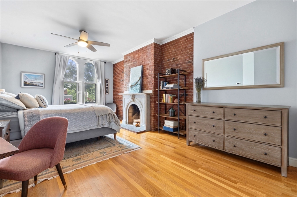 35 High Street, Unit 1 Boston, MA 02129 - Photo 3 of 33 a bedroom with a bed and wooden floor