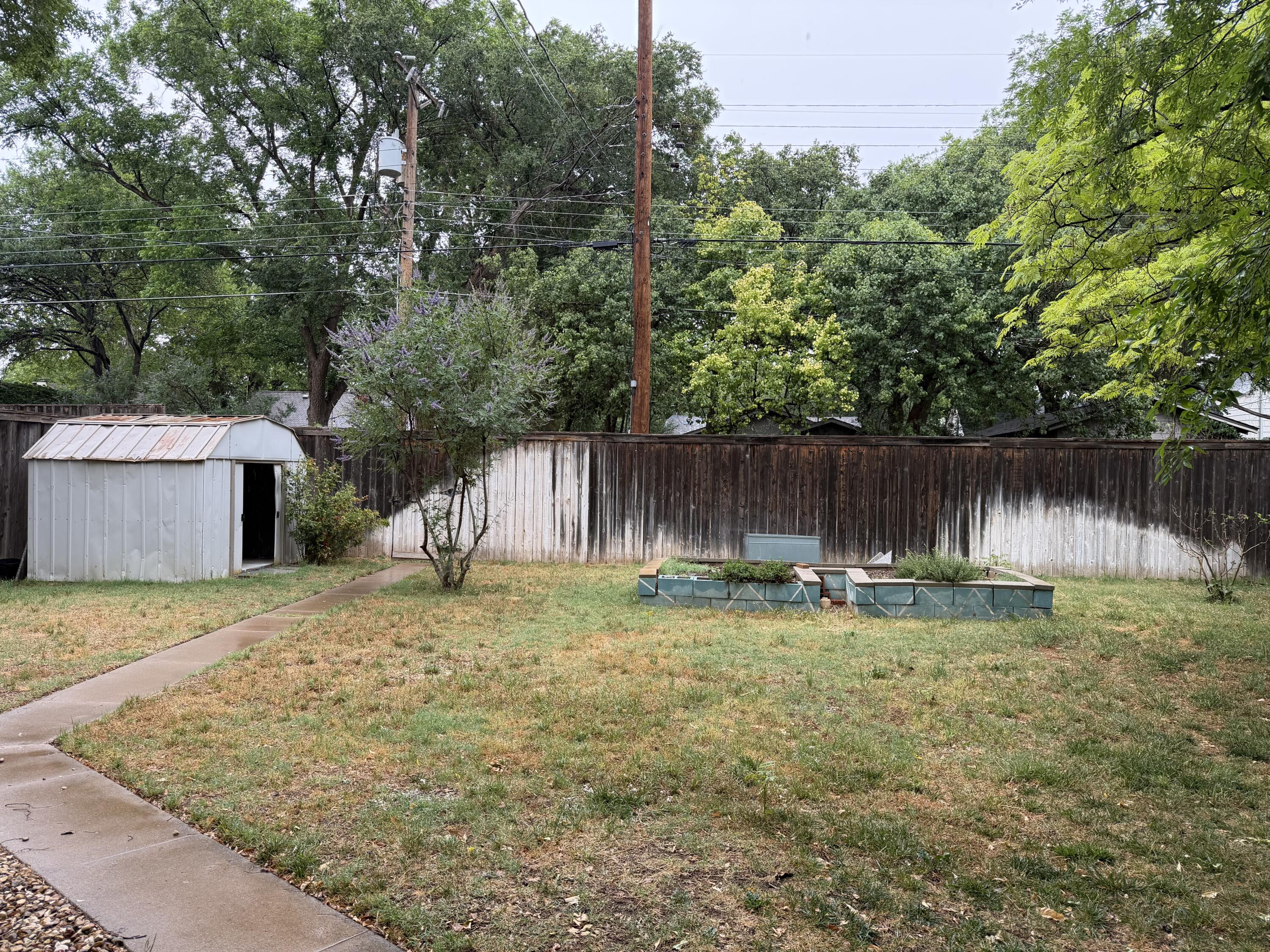 3110 22nd Street Lubbock, TX 79410 - Photo 21 of 22 a backyard of a house with lots of green space