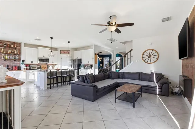 a kitchen with a sink a counter space and cabinets