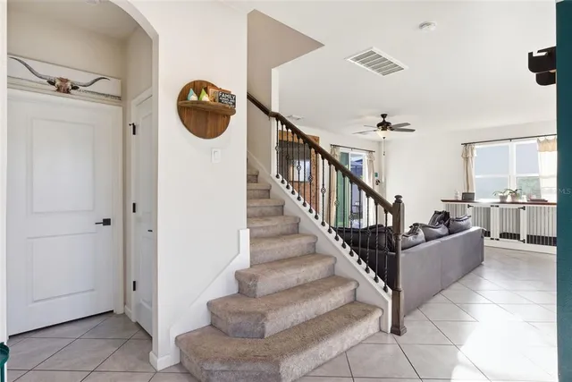 a view of entryway and hall with dining room
