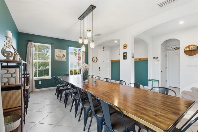 a dining room with furniture window wooden floor