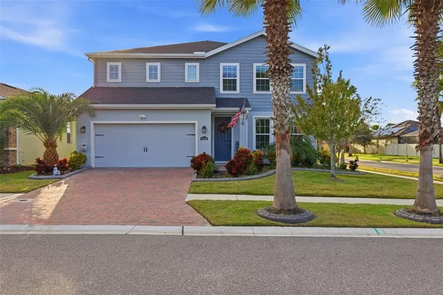 a view of a porch with furniture and a yard
