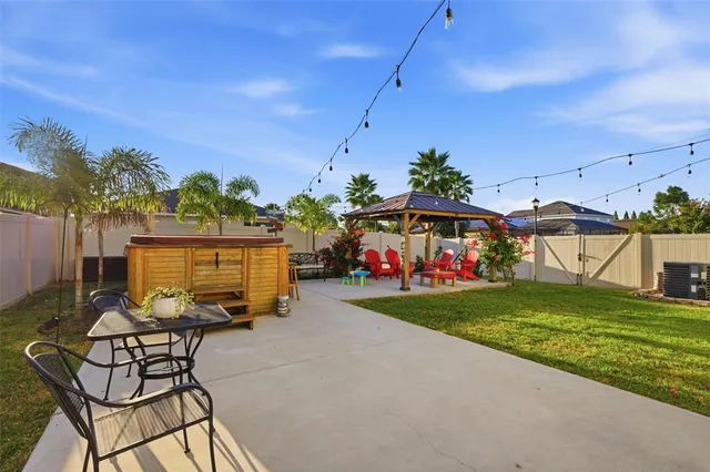a bed room with a bed and a ceiling fan