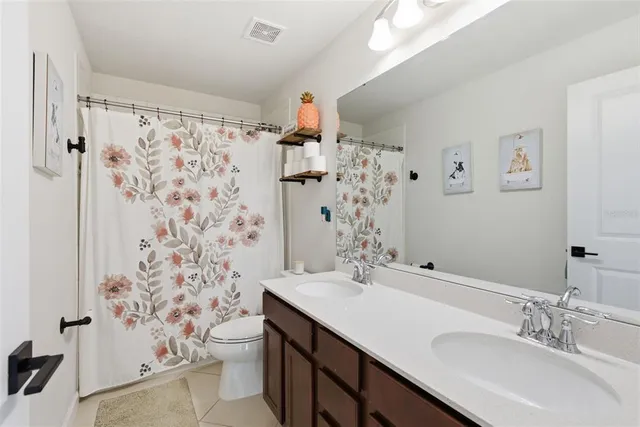 an aerial view of a house with a yard and garden