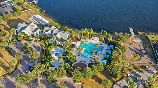 an aerial view of a house with a yard and garden space