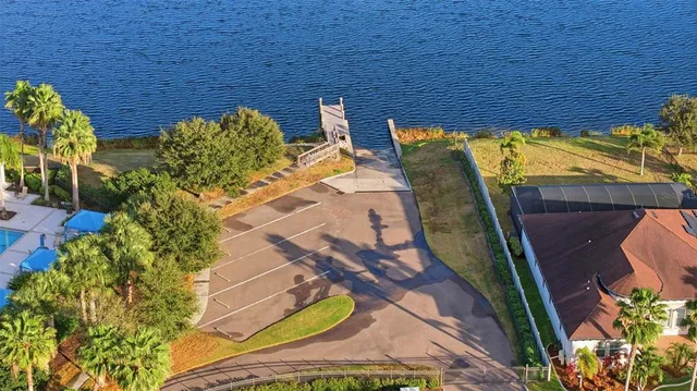 a view of a workspace with furniture and a flat screen tv