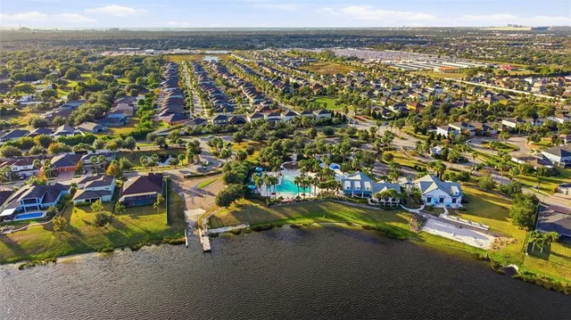 a bedroom with a bed a dresser and a flat screen tv