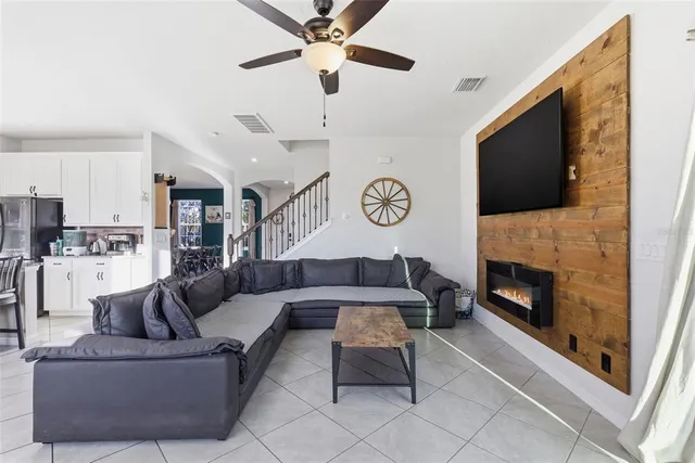 a living room with furniture and a large window