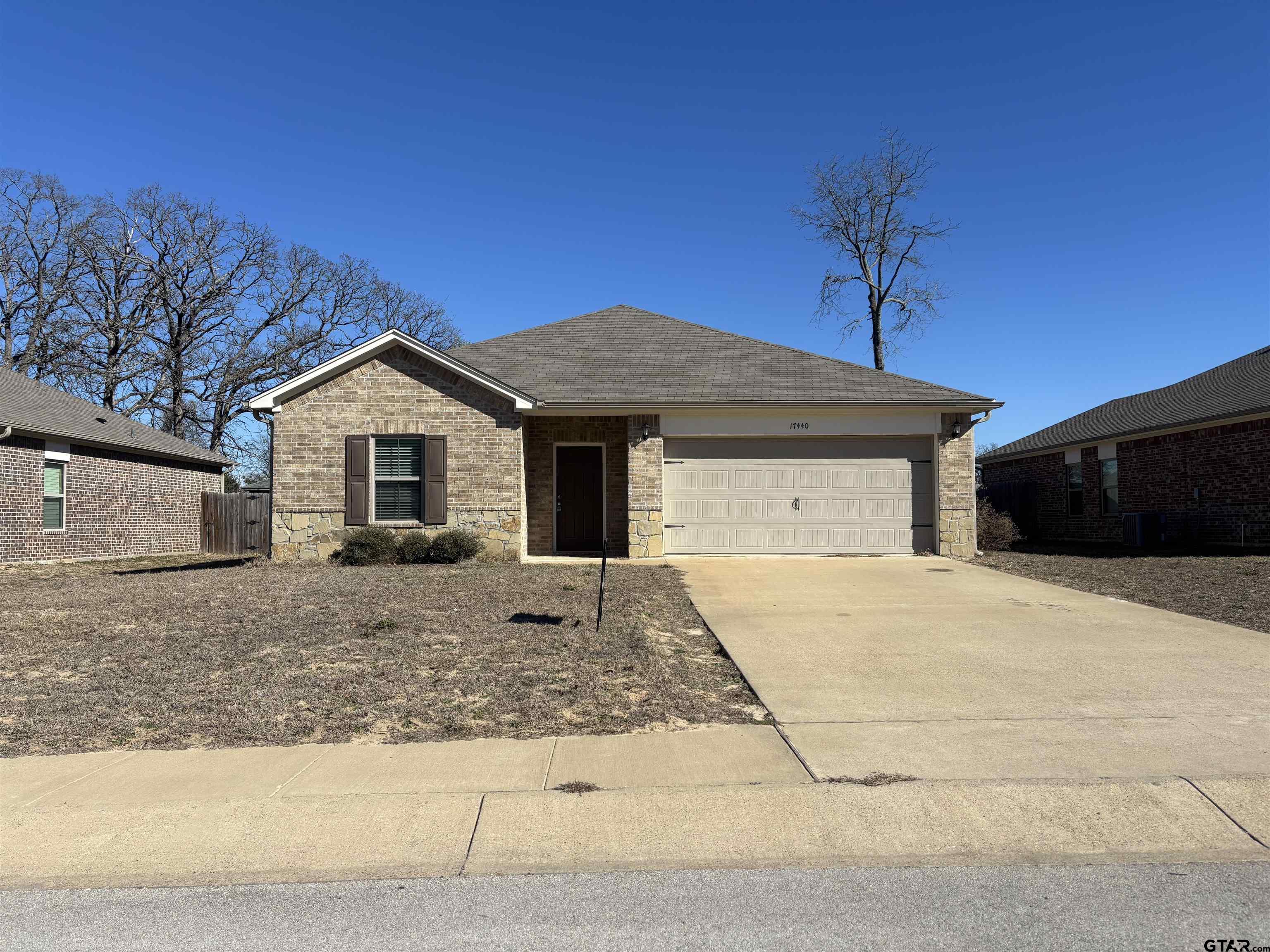 17440 Stacy Street Lindale, TX 75771 - Photo 1 of 9 a front view of a house with a yard
