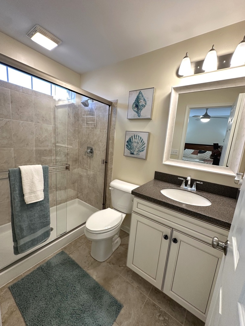 5102 Monroe Street Matteson, IL 60443 - Photo 33 of 54 a bathroom with a toilet a sink a mirror a vanity and shower