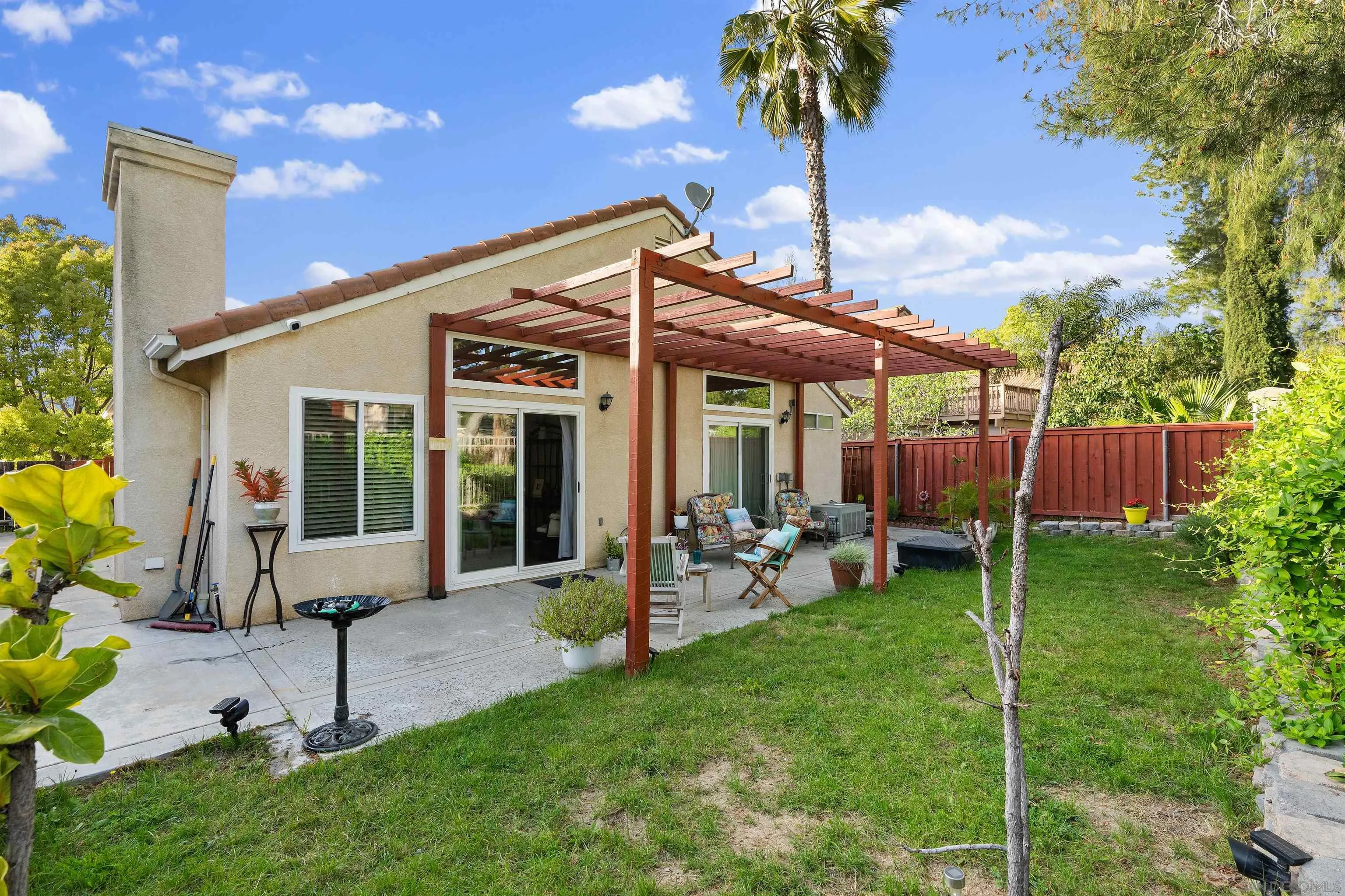 43070 Corte Salamanca Temecula, CA 92592 - Photo 19 of 30 a view of a chair and table in backyard of the house