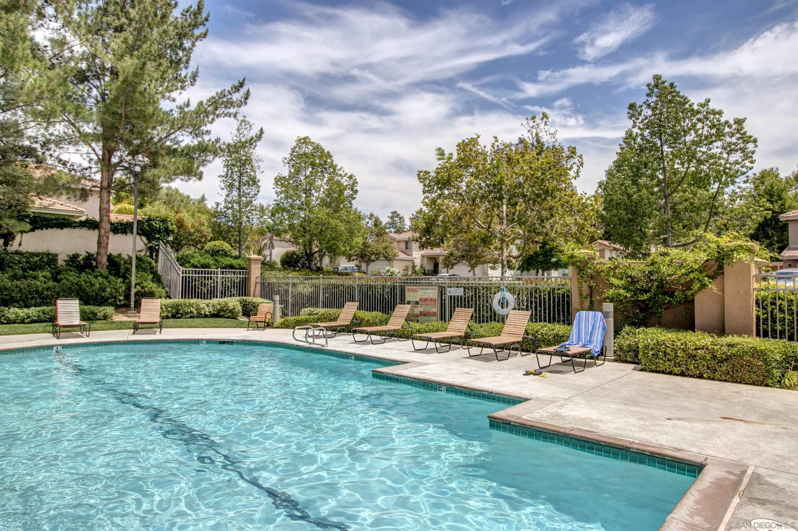 43070 Corte Salamanca Temecula, CA 92592 - Photo 25 of 30 a view of a swimming pool with lounge chairs in the patio