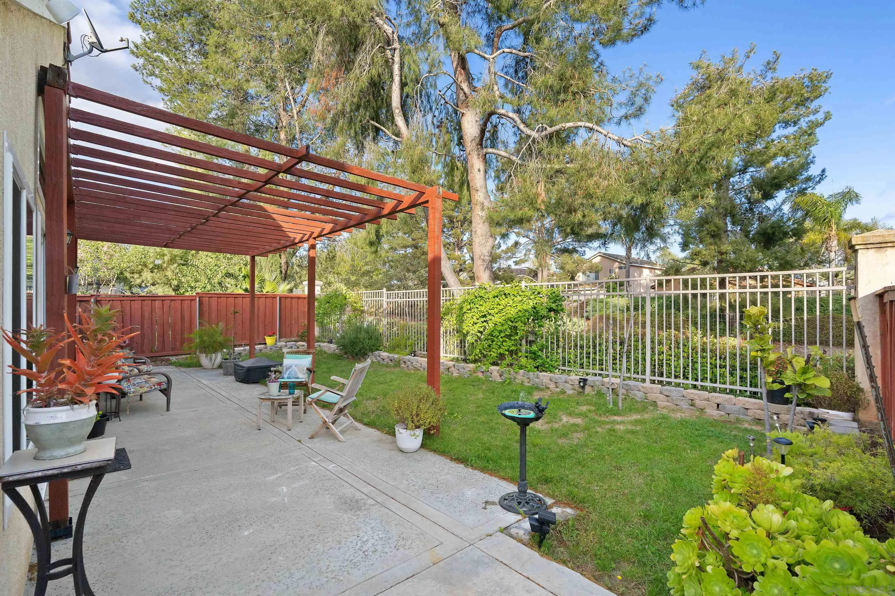 43070 Corte Salamanca Temecula, CA 92592 - Photo 6 of 30 a view of a chair and tables in the backyard