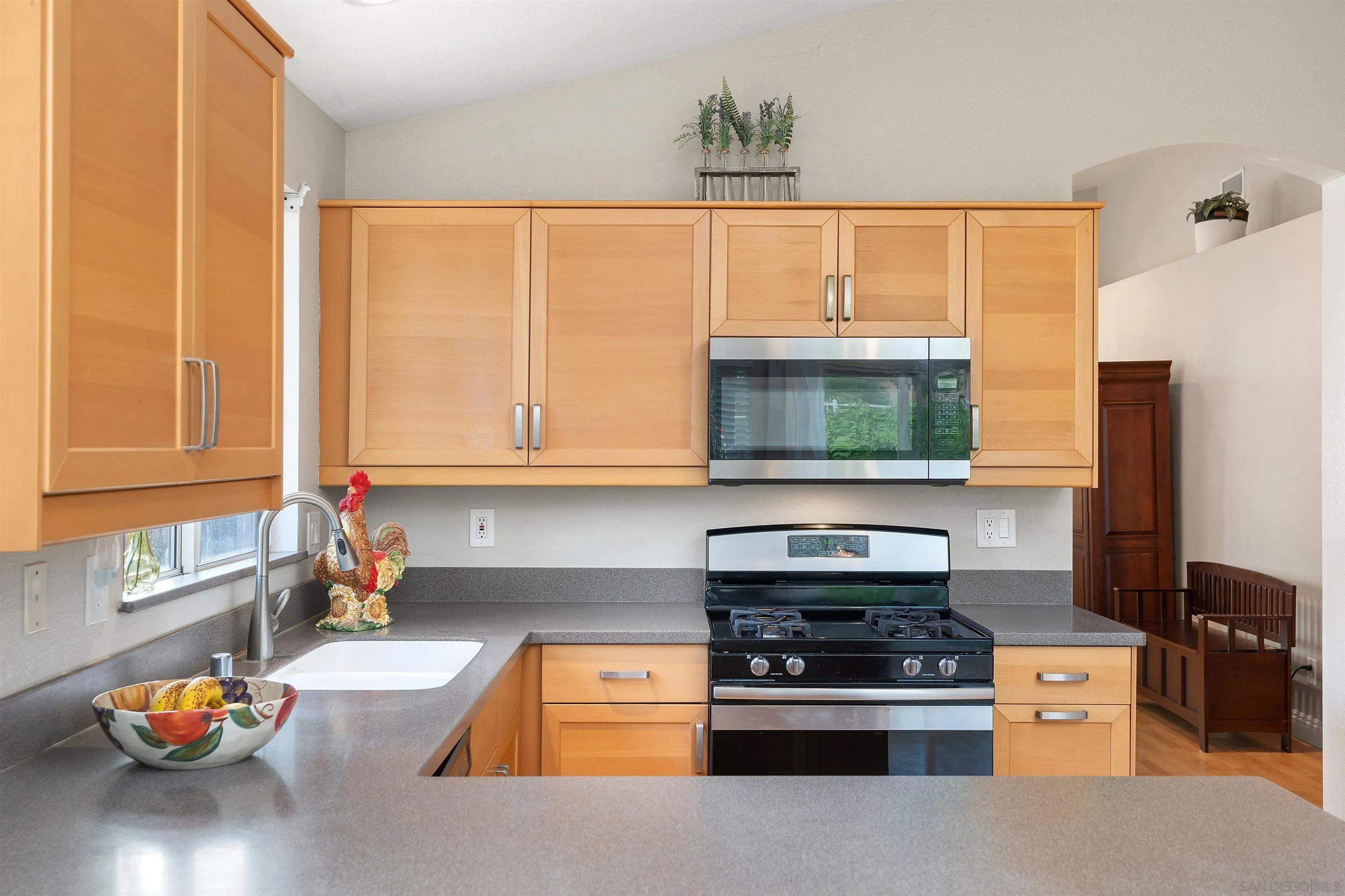 43070 Corte Salamanca Temecula, CA 92592 - Photo 8 of 30 a kitchen with stainless steel appliances a stove and a microwave