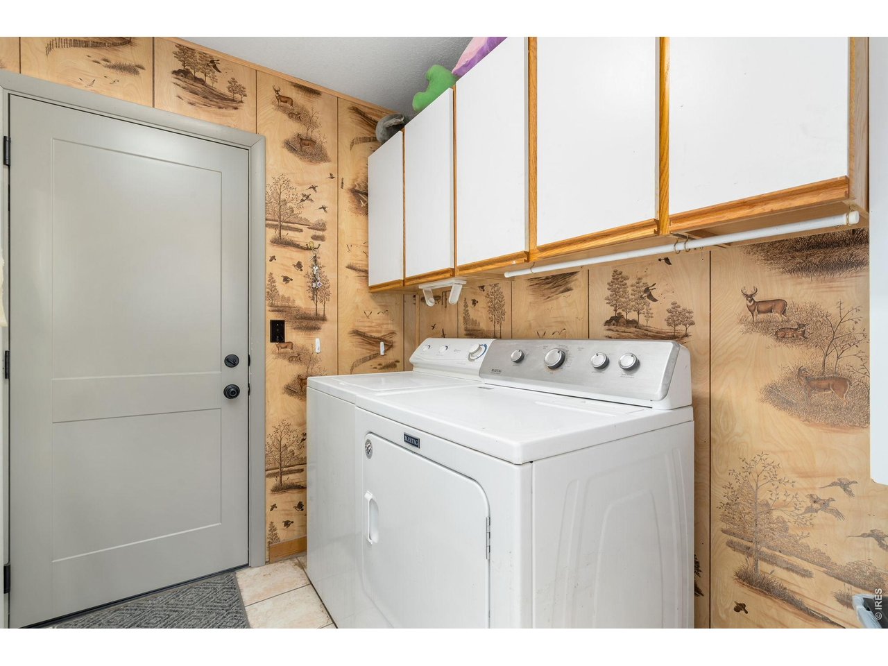 141 Tami Road Red Feather Lakes, CO 80545 - Photo 17 of 45 Laundry/mud room leads directly to the attached, oversized two car garage.