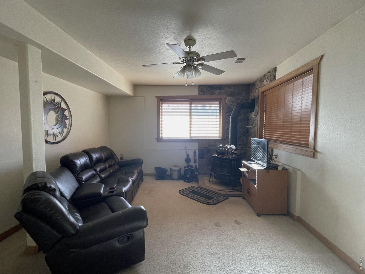 141 Tami Road Red Feather Lakes, CO 80545 - Photo 18 of 45 Second living room, game room in the walk-out basement. Wood burning stove warms the whole home.