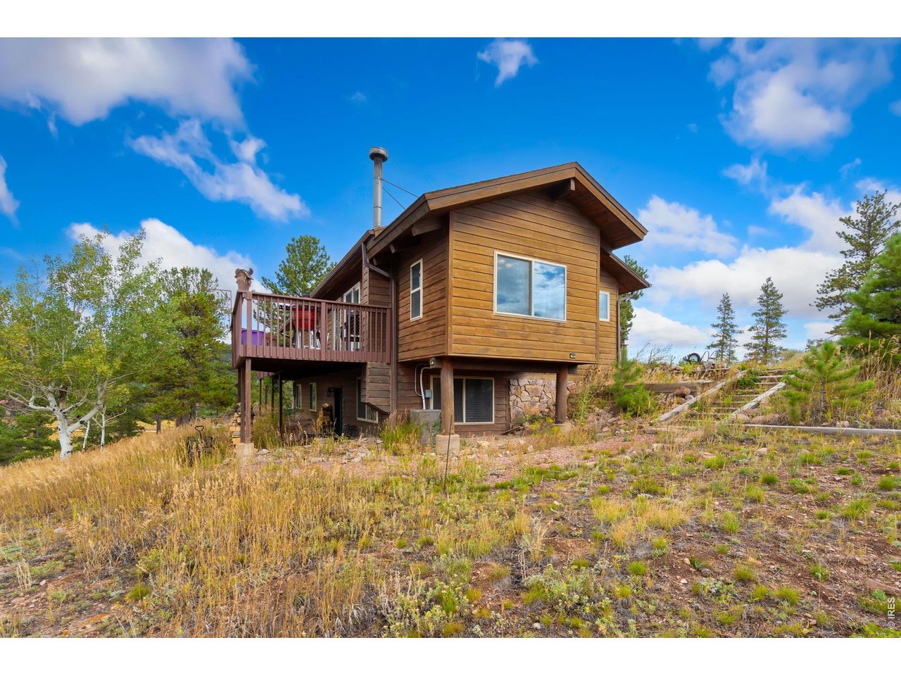 141 Tami Road Red Feather Lakes, CO 80545 - Photo 32 of 45 South elevation (bump out is the dining area),