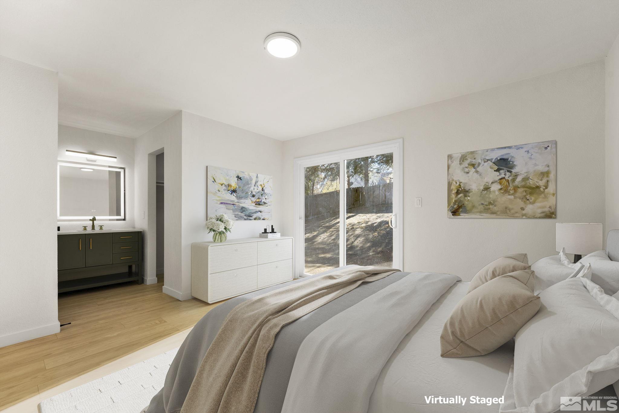 1720 Kings Row Reno, NV 89503 - Photo 20 of 39 a bedroom with a bed and a large window