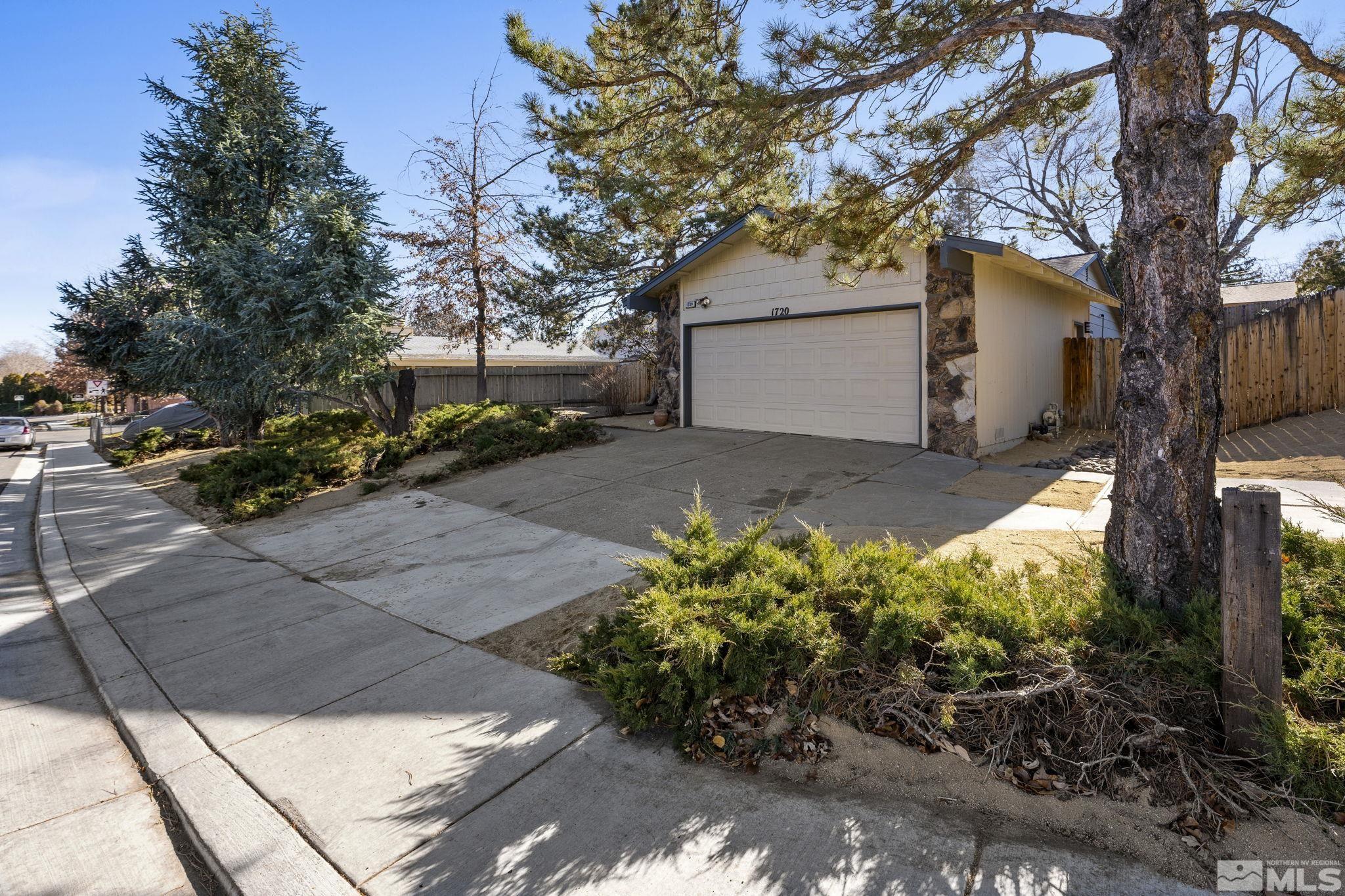 1720 Kings Row Reno, NV 89503 - Photo 2 of 39 a backyard of a house with lots of green space