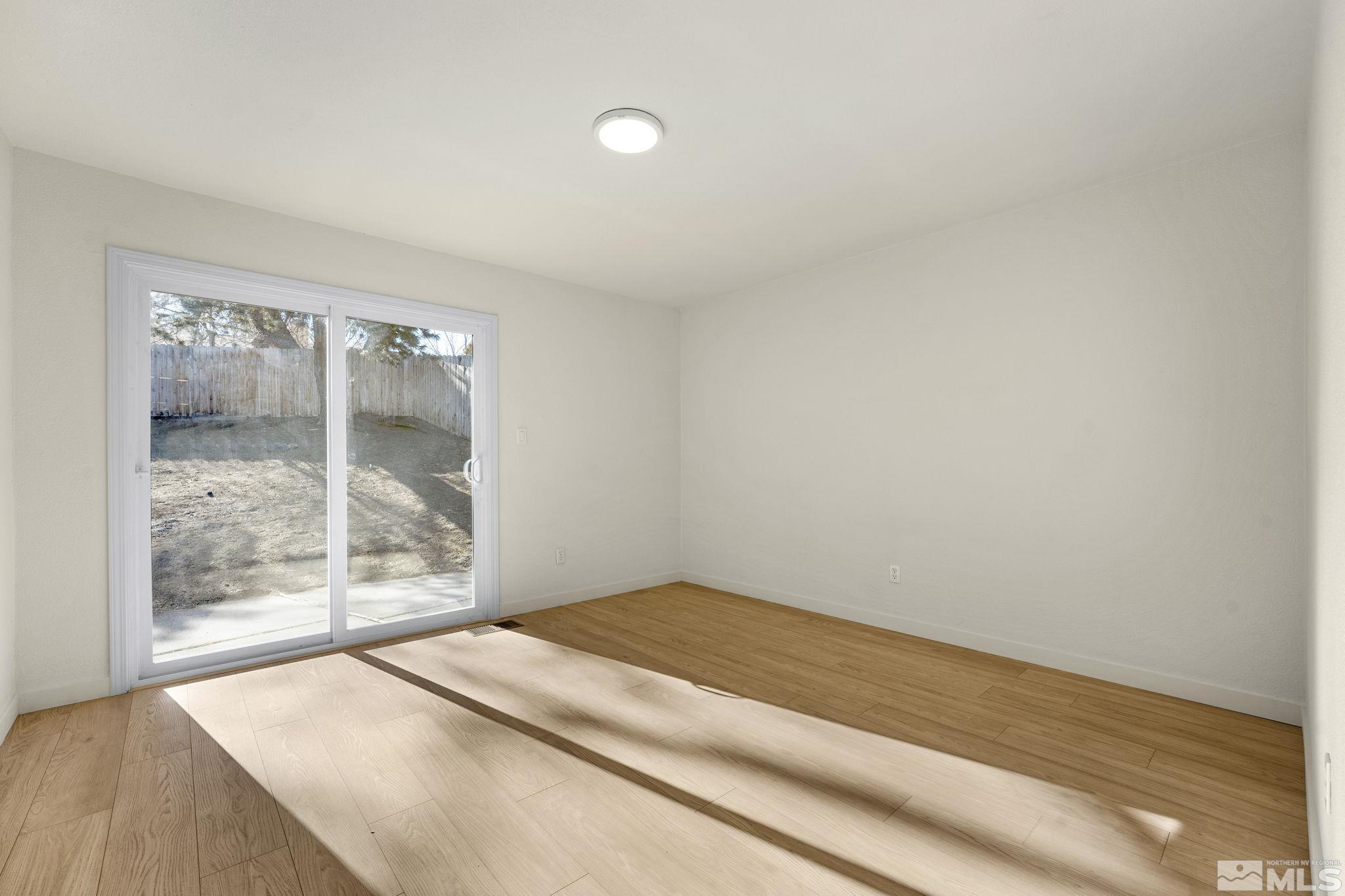 1720 Kings Row Reno, NV 89503 - Photo 21 of 39 a bedroom with a bed and a window