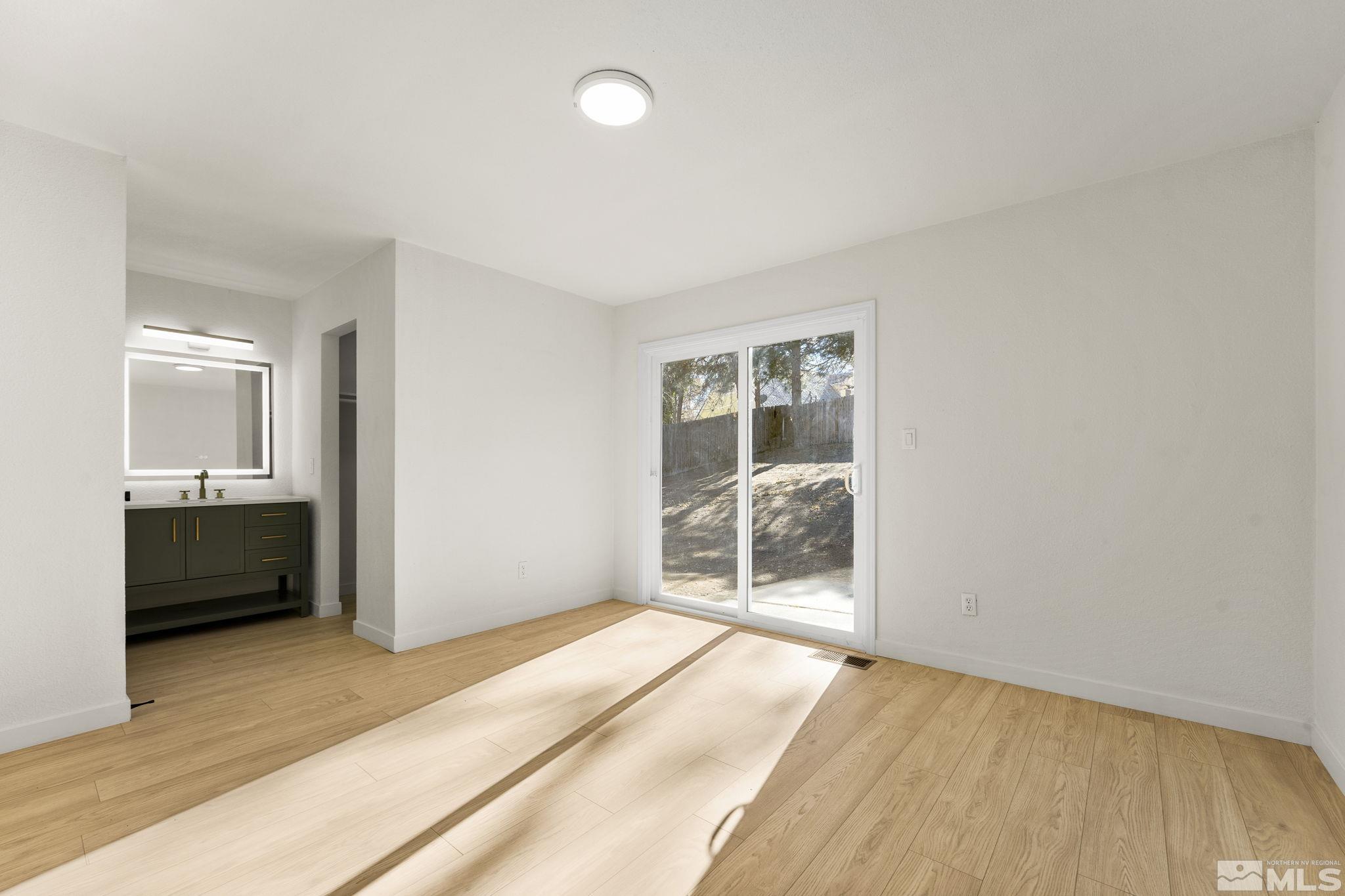 1720 Kings Row Reno, NV 89503 - Photo 22 of 39 a bedroom with a bed and a window