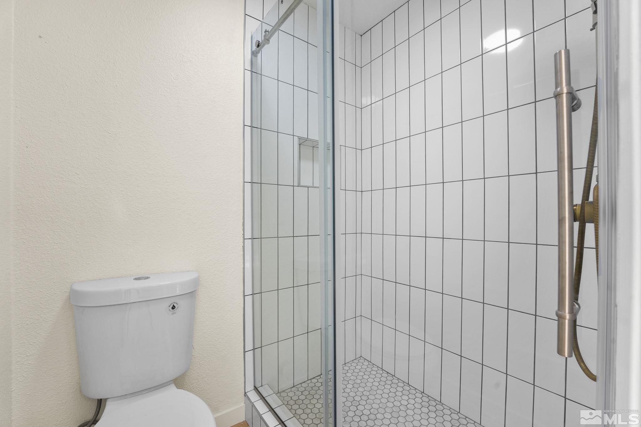 1720 Kings Row Reno, NV 89503 - Photo 25 of 39 a bathroom with a toilet and shower