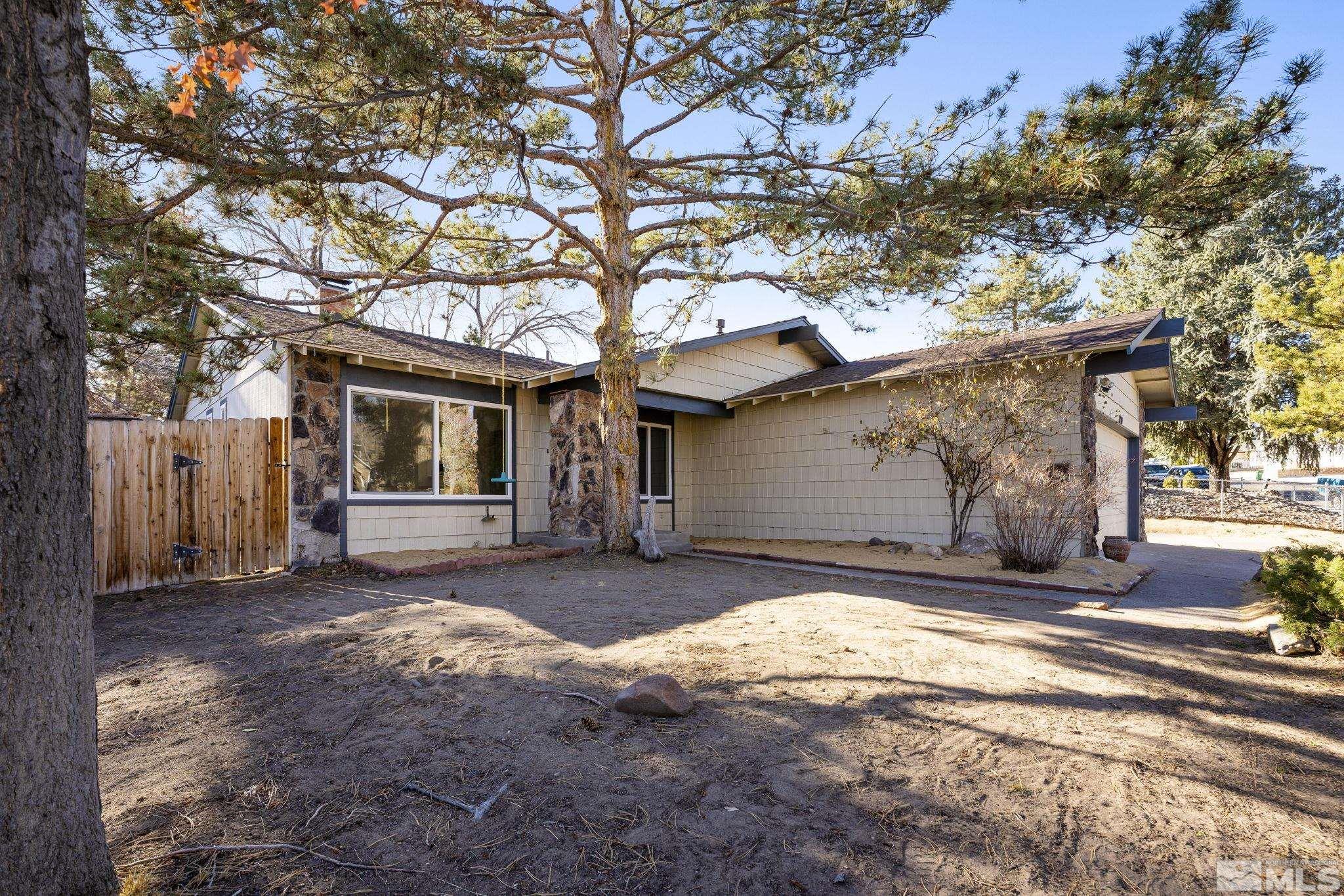 1720 Kings Row Reno, NV 89503 - Photo 3 of 39 a house that has a tree in front of it