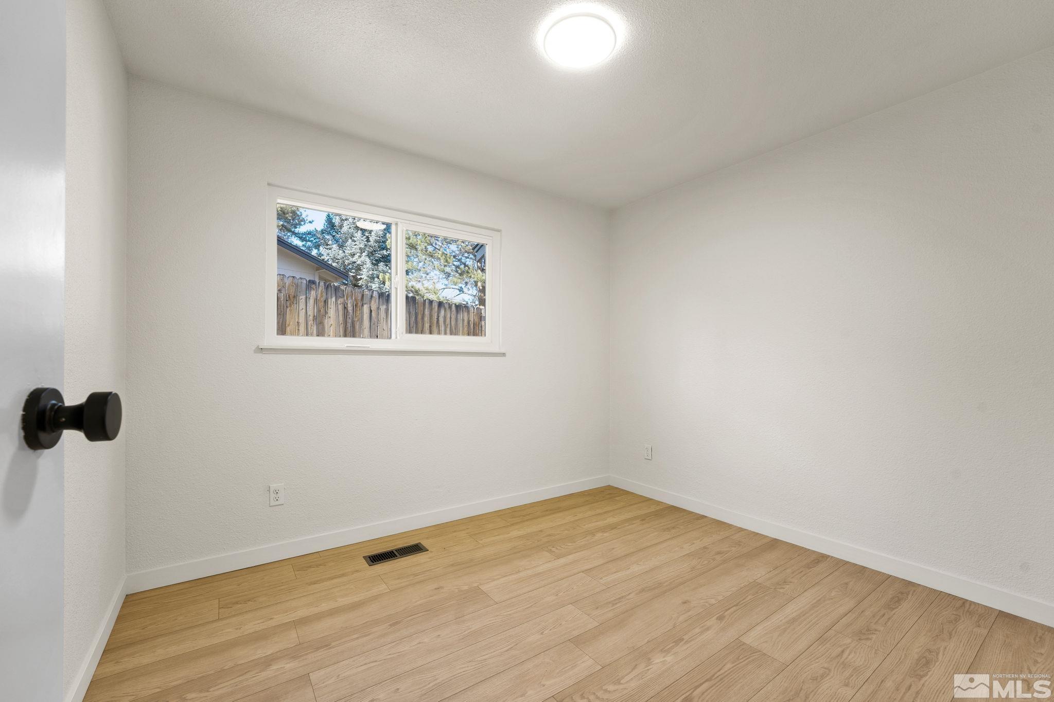1720 Kings Row Reno, NV 89503 - Photo 31 of 39 a view of a room with a wooden floor and a window