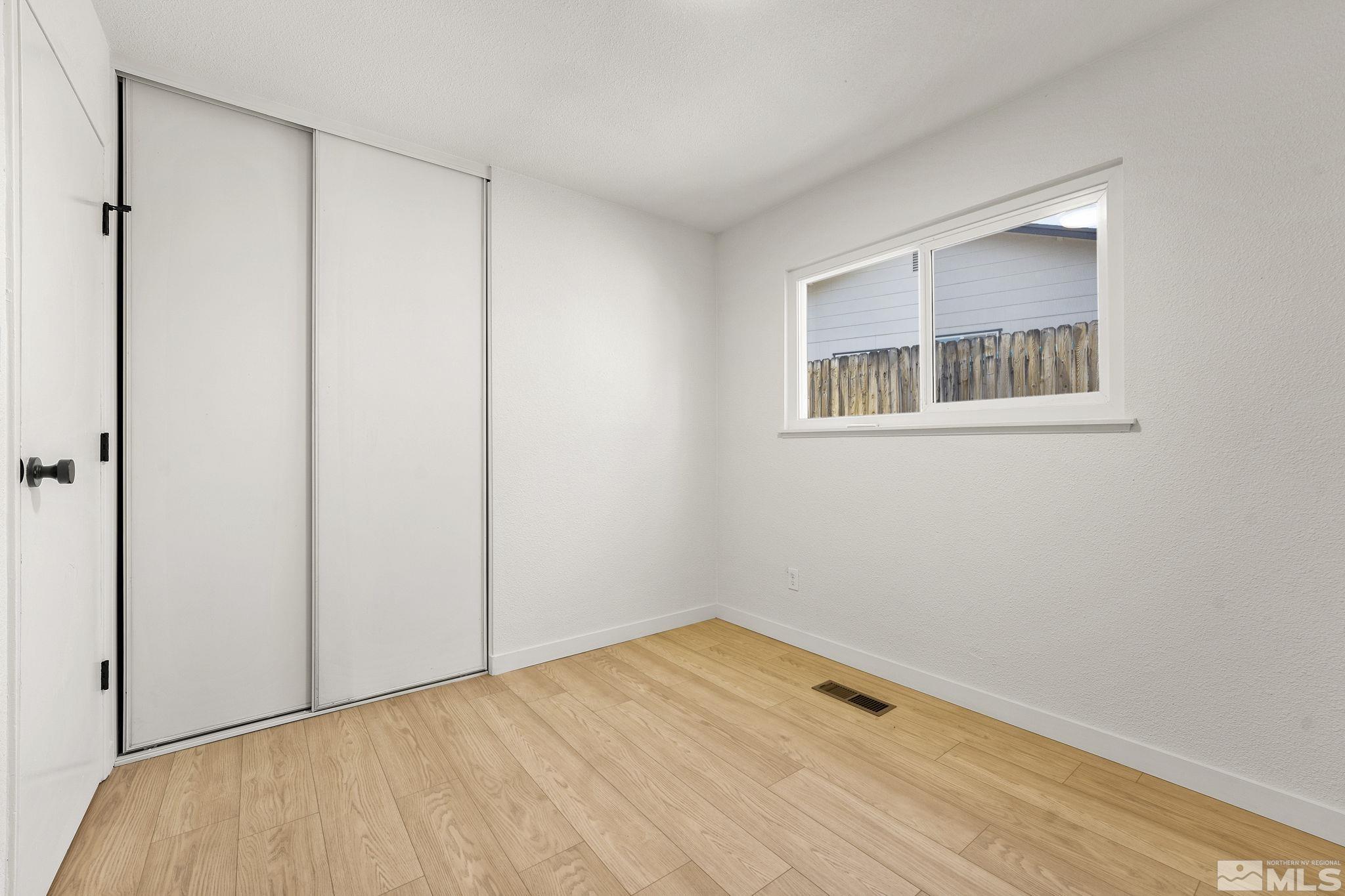 1720 Kings Row Reno, NV 89503 - Photo 32 of 39 a view of an empty room with closet and a window