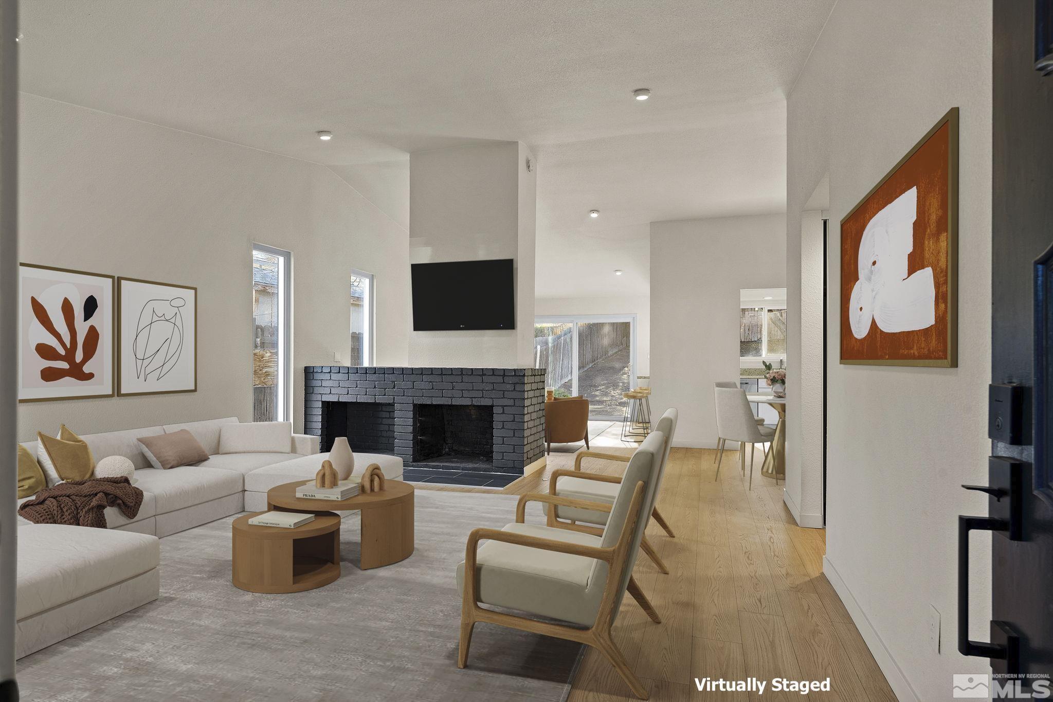 1720 Kings Row Reno, NV 89503 - Photo 4 of 39 a living room with furniture and a fireplace