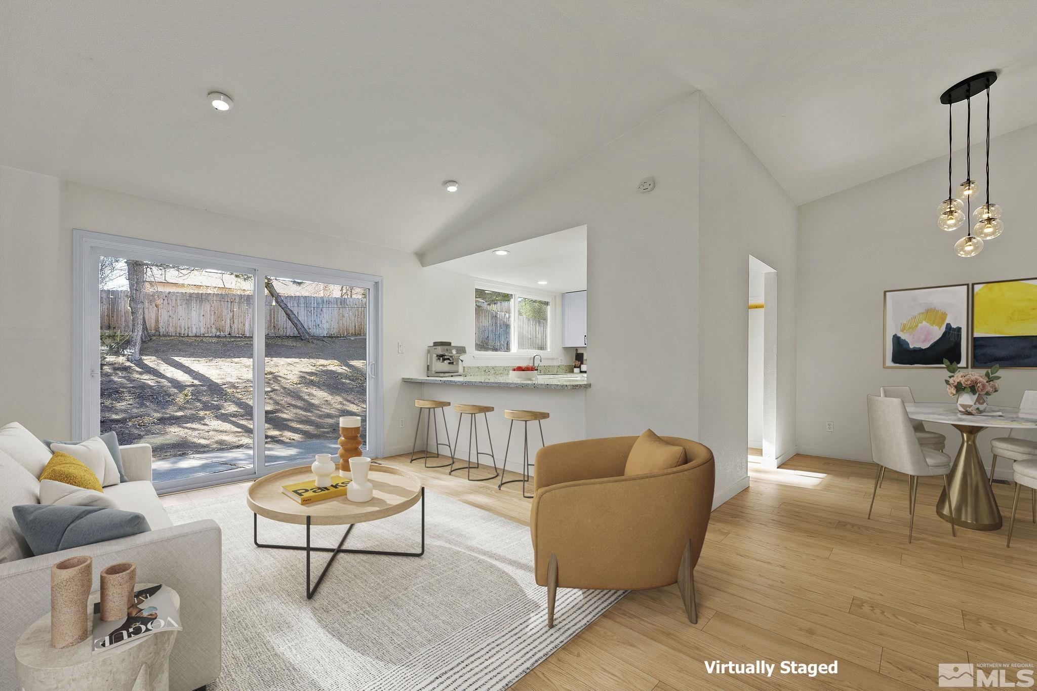 1720 Kings Row Reno, NV 89503 - Photo 5 of 39 a living room with furniture a rug and a floor to ceiling window