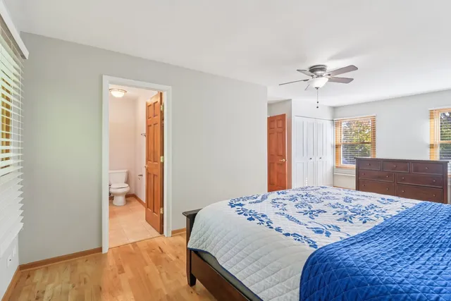 a bedroom with a bed and a dresser