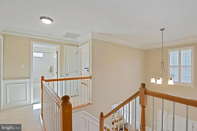 a view of a hallway with a door