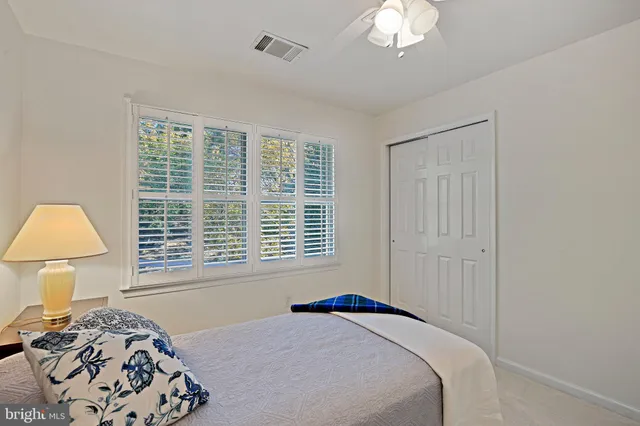 a view of a house with a tree in the yard