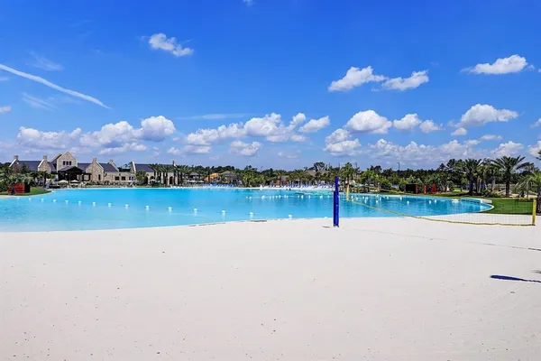a view of a lake with houses in the back