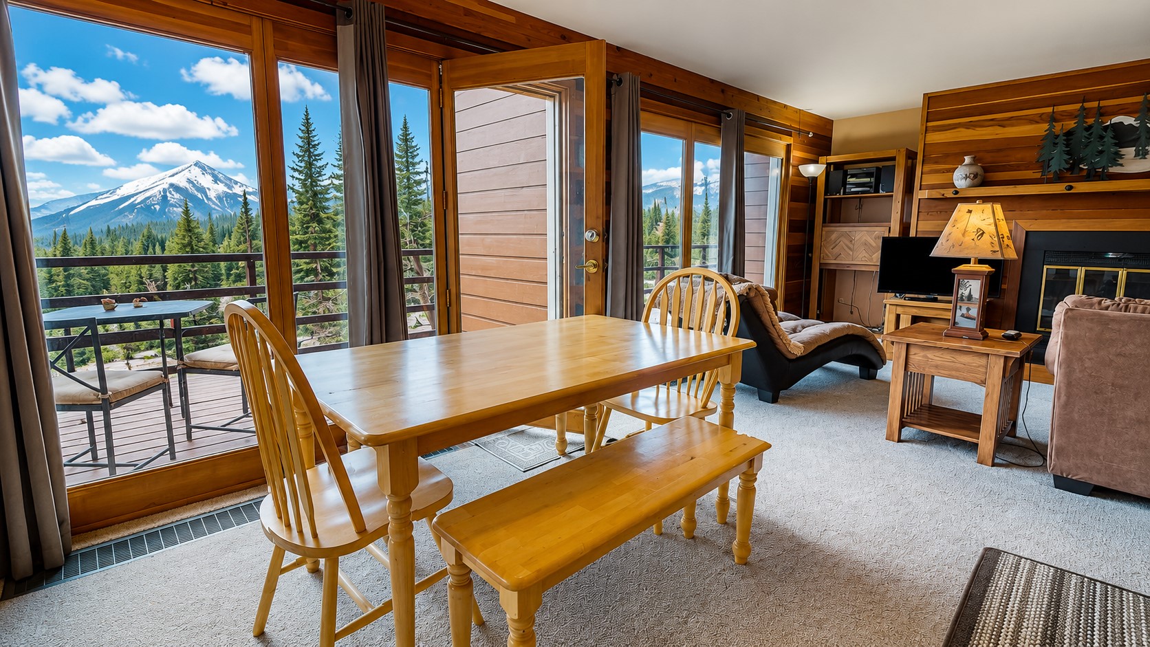 91200 Ryan Gulch Road, Unit 213 Silverthorne, CO 80498 - Photo 4 of 33 a dining room with furniture and a floor to ceiling window