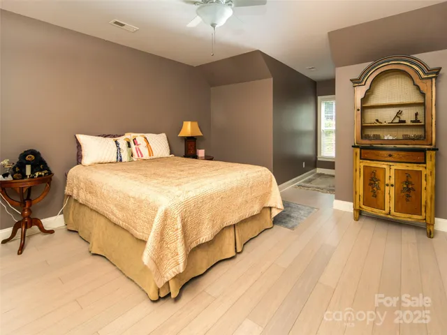 a bedroom with a bed and a stove