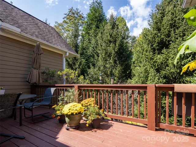 a wooden bench sitting in front of a building