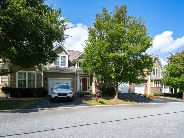 a view of building with car parked