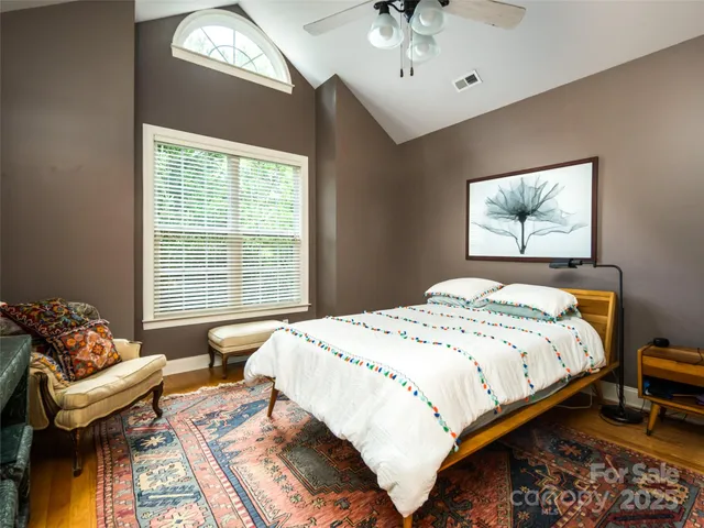 a bedroom with a bed and a couch