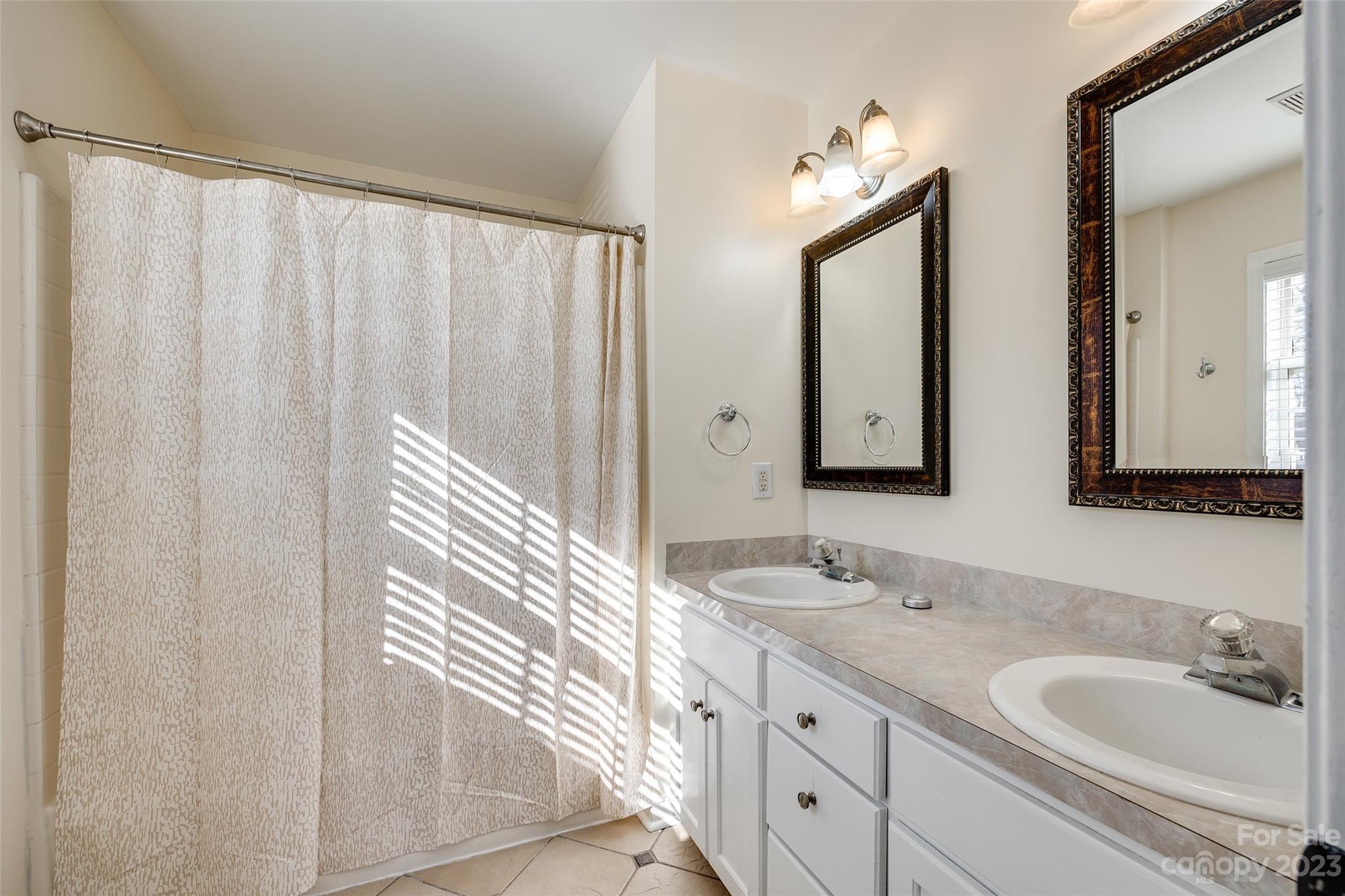 573 Strathclyde Way Rock Hill, SC 29730 - Photo 14 of 21 a bathroom with 2 sink and a mirror