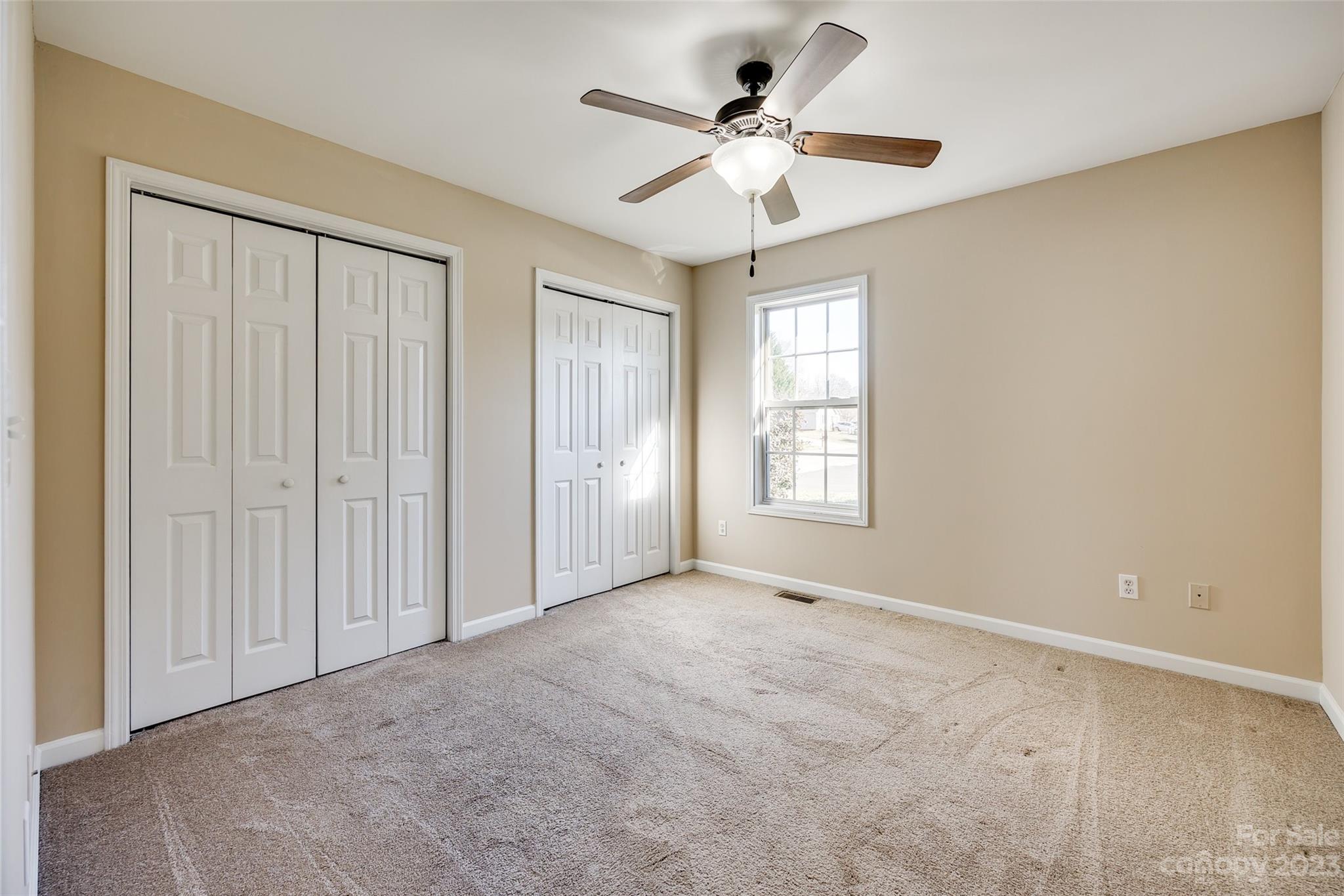 573 Strathclyde Way Rock Hill, SC 29730 - Photo 15 of 21 an empty room with a ceiling fan and a window