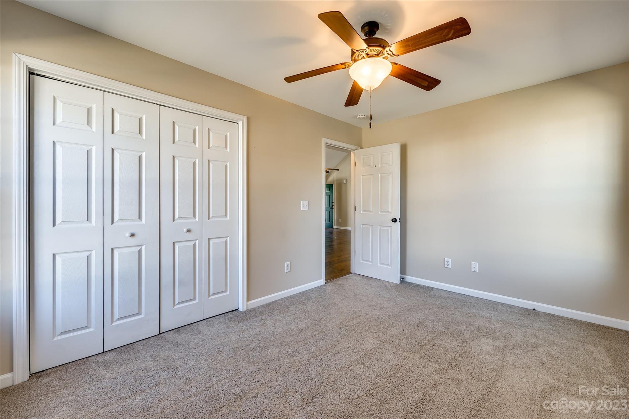573 Strathclyde Way Rock Hill, SC 29730 - Photo 16 of 21 an empty room with closet and a ceiling fan