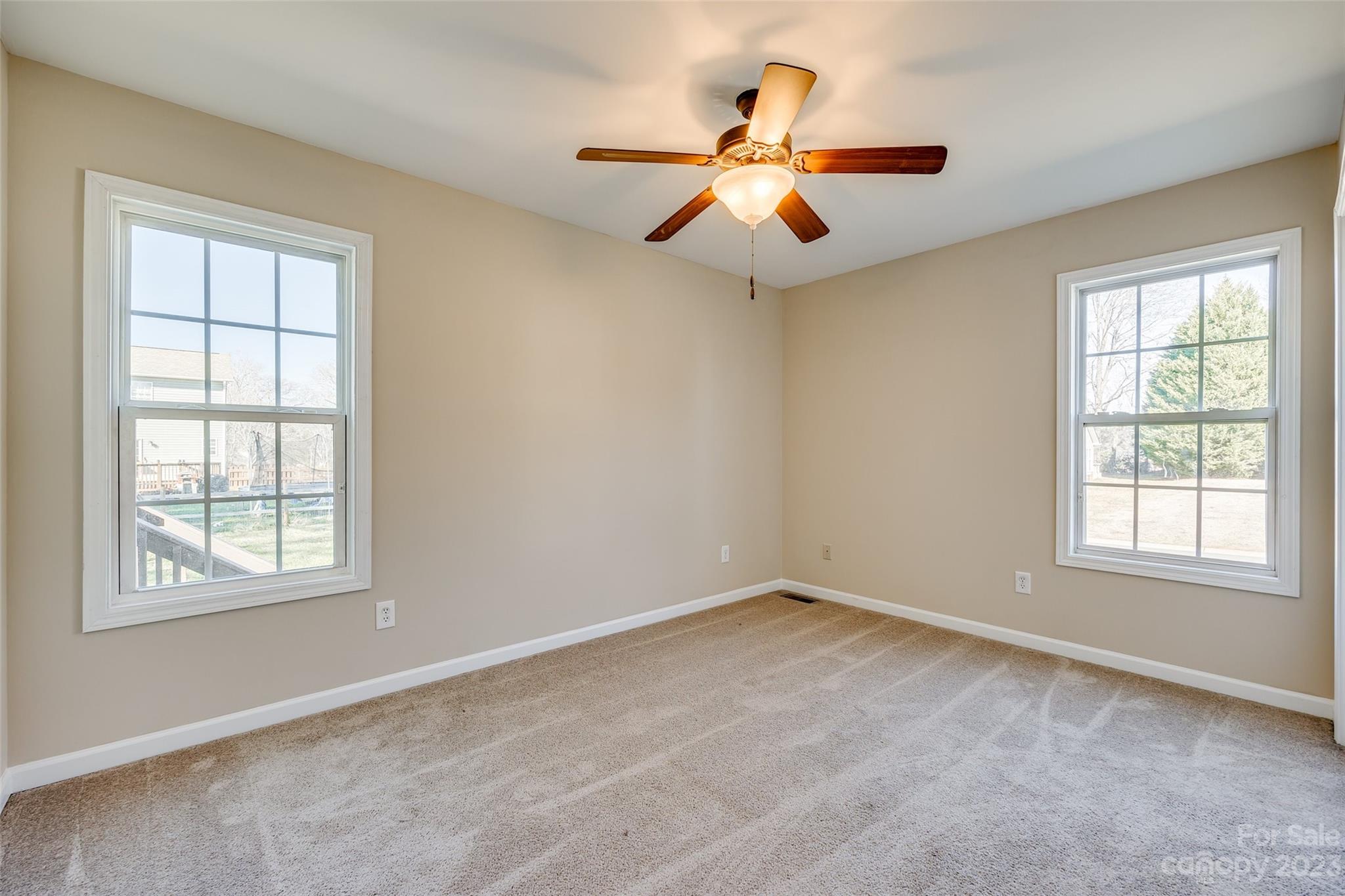 573 Strathclyde Way Rock Hill, SC 29730 - Photo 17 of 21 an empty room with windows and fan