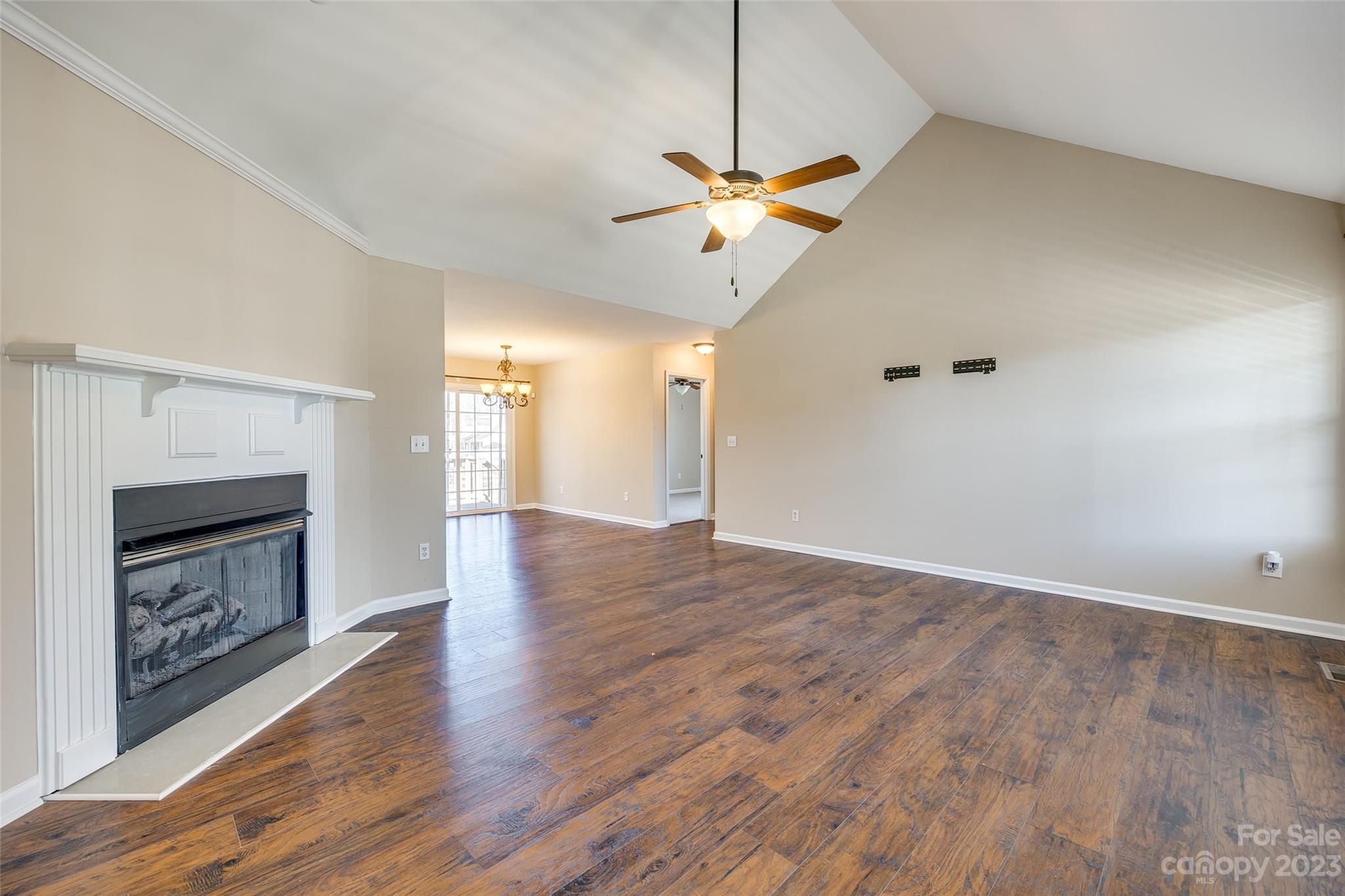 573 Strathclyde Way Rock Hill, SC 29730 - Photo 4 of 21 a view of an empty room with wooden floor and a fireplace