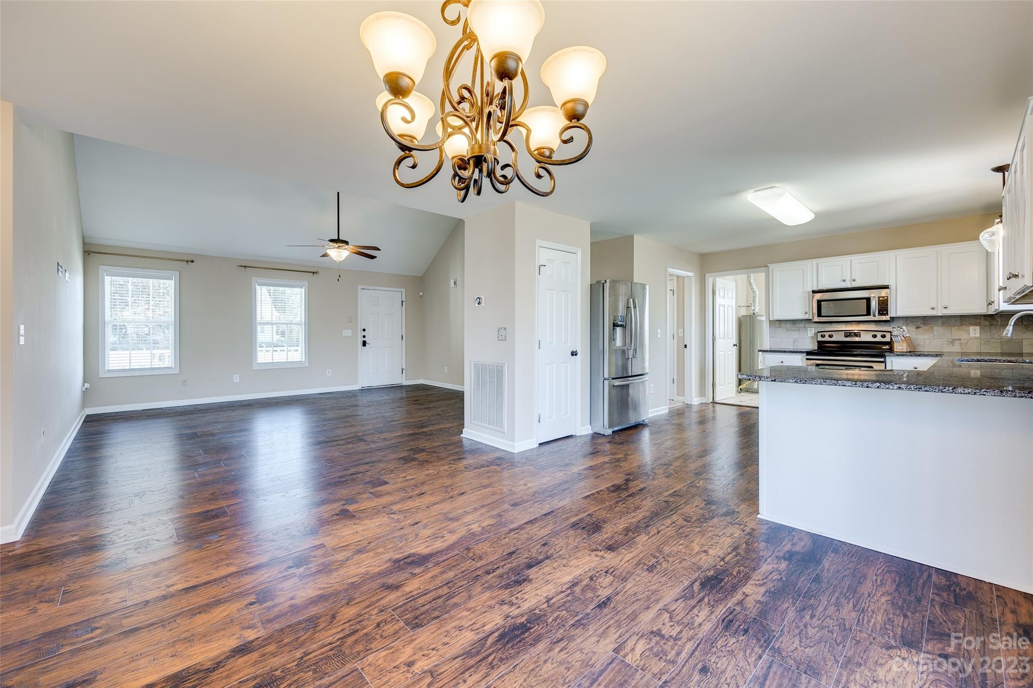 573 Strathclyde Way Rock Hill, SC 29730 - Photo 7 of 21 a view of a kitchen with a dishwasher cabinets and wooden floor