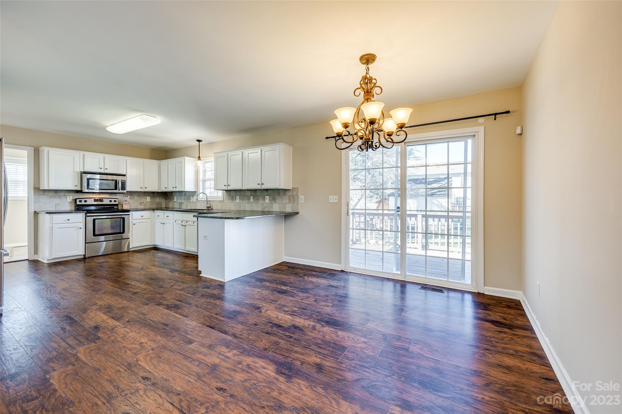 573 Strathclyde Way Rock Hill, SC 29730 - Photo 8 of 21 a view of a kitchen with a stove cabinets and wooden floor