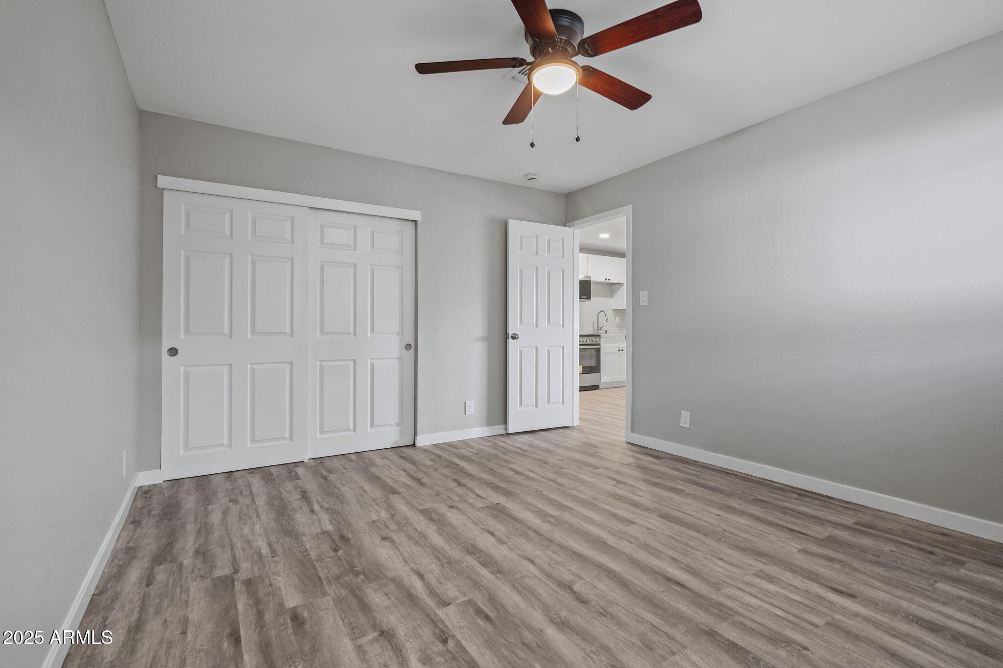 1940 West Amelia Avenue, Unit 1942 5 Phoenix, AZ 85015 - Photo 17 of 18 wooden floor in an empty room