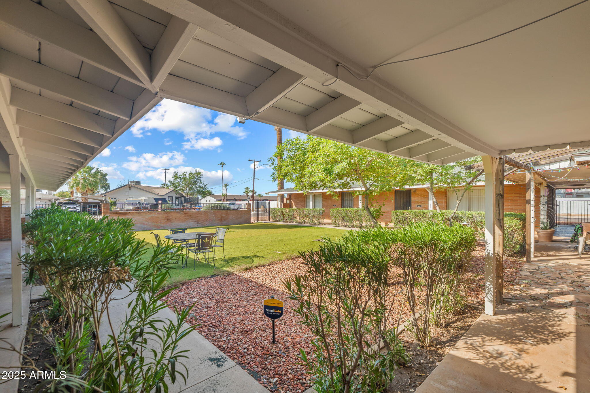 1940 West Amelia Avenue, Unit 1942 5 Phoenix, AZ 85015 - Photo 2 of 18 a view of a garden with plants