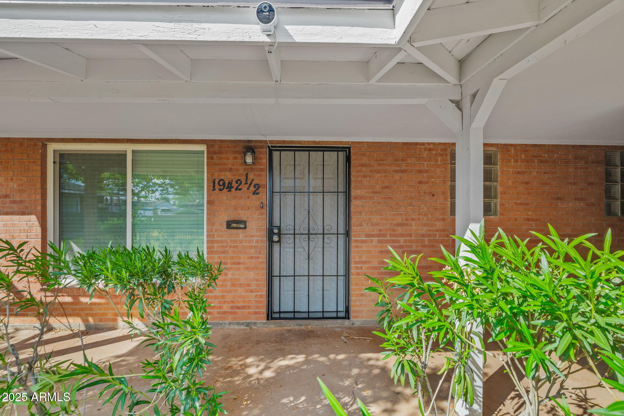 1940 West Amelia Avenue, Unit 1942 5 Phoenix, AZ 85015 - Photo 6 of 18 a front view of a house
